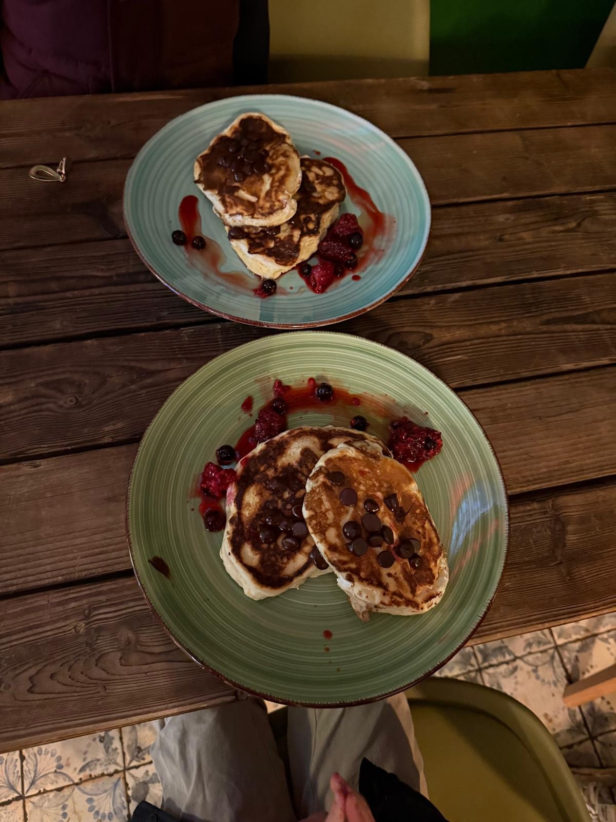 Pancakes with berries and chocolate at the café