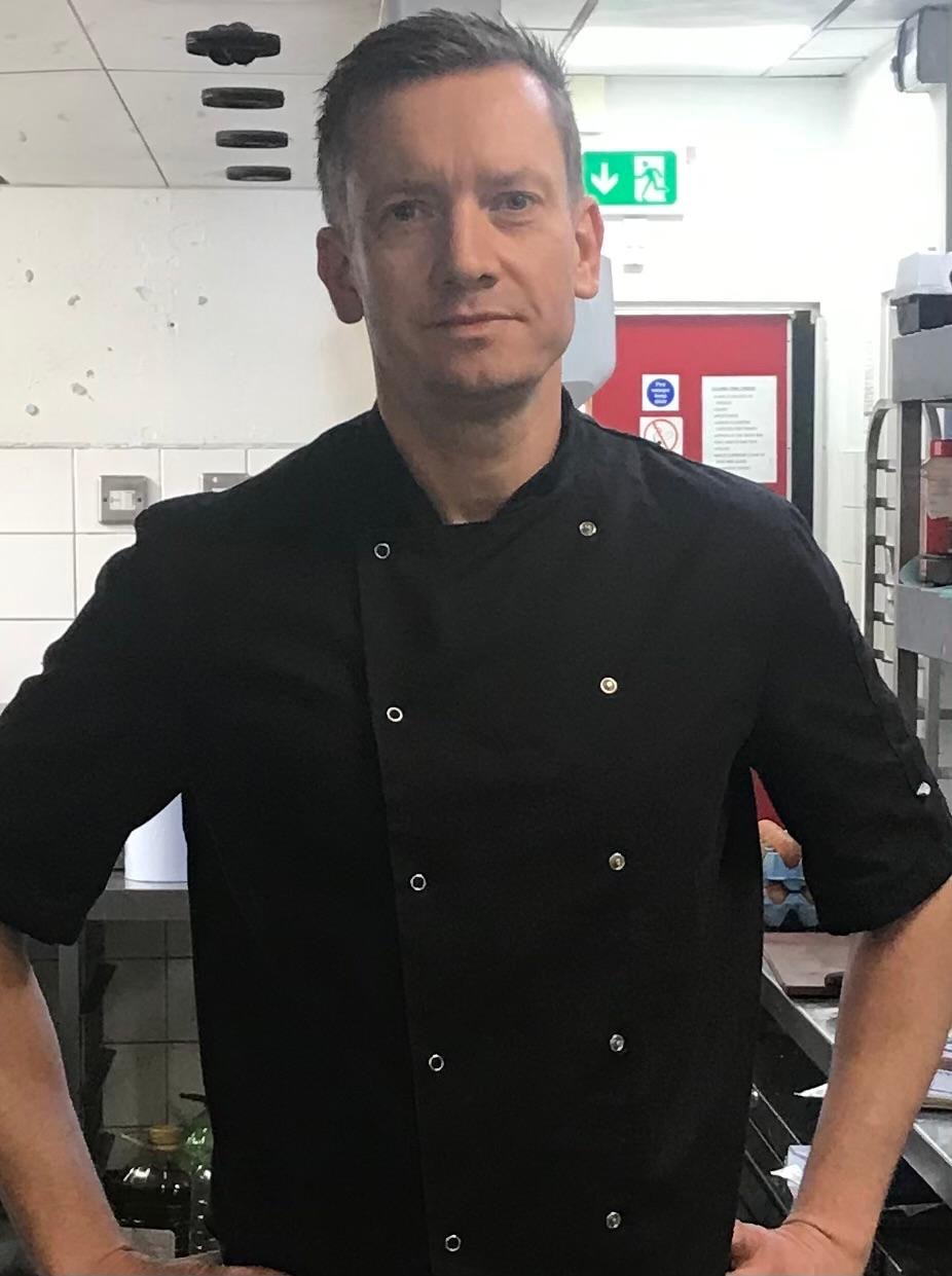 Pavel, the chef behind BoxChef, in his kitchen in chef’s whites